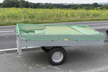 trailer with net for load securing