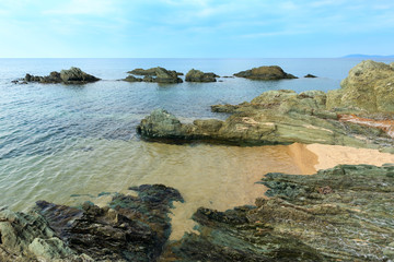 Summer morning rocky coast (Chalkidiki, Greece).