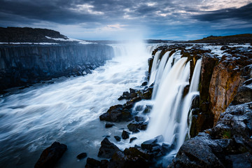 Rapid flow of water powerful Selfoss cascade. Popular tourist attraction.