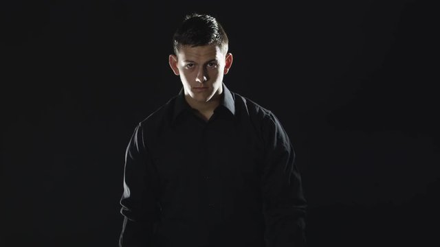 Slow motion man with black shirt and black background