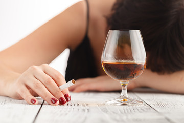 Woman alcoholism is social problem. Female drinking of  whiskey is cause of nervous stress