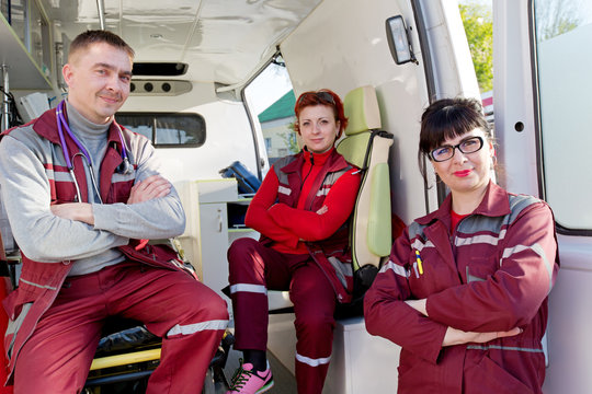 Emergency Medicine: Positive ER Doctor with Paramedics Medical Technician  in Ambulance Car