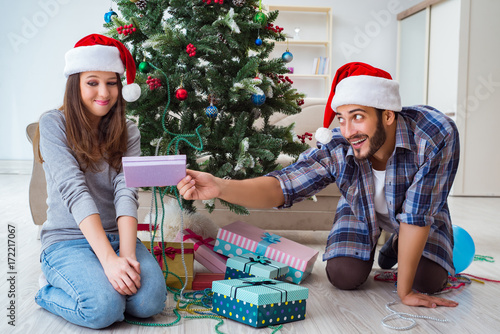 &quot;Girlfriend and boyfriend opening christmas gifts&quot; Stock photo and