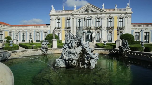 Baroque facade of Queluz National Palace and Neptune Fountain in Sintra, Lisbon district. Defined as the Versailles of Portugal, the Royal Palace of Queluz was used as a fun place for the royal family