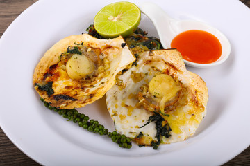 Baked scallops with spinach