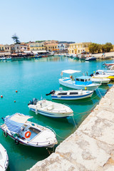 Fototapeta na wymiar Boats in the old Venetian Harbor of Rethymno