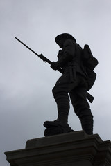 Silhouette of a British Tommy on the top of the war memorial in Portstewart in Conyu Londonderry, Northern Ireland