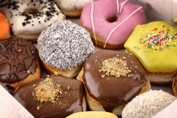 Bright and colorful donuts close-up in a box