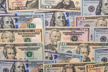 Many different us dollar as background