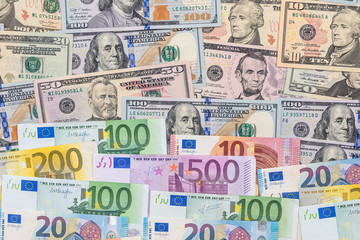 mix dollar and euro bills. background. money.