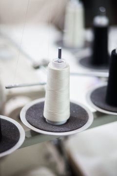 Spool of white thread.