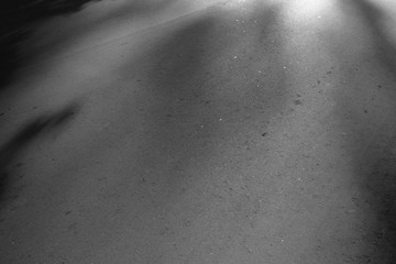 Asphalt background texture. New fresh asphalt black and white. Lights and shadows