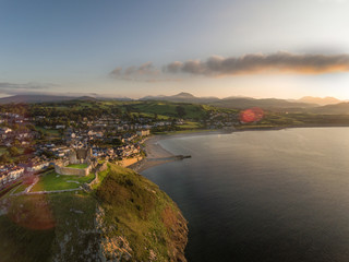 Fototapeta premium Criccieth Castle, town, seafront and coast aerial view, Wales, UK.