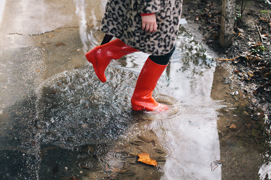 Woman standing in the puddle - Powered by Adobe