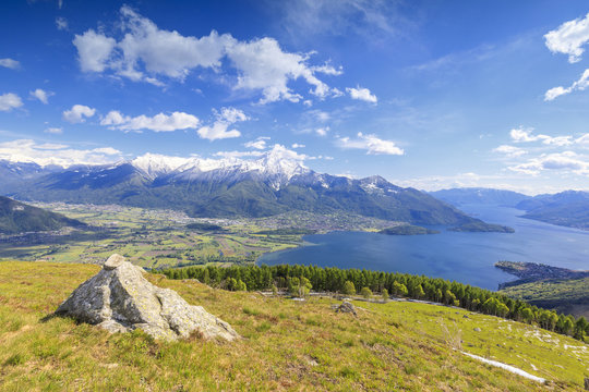 Lake Como framed by green meadows and woods in spring Montemezzo Alpe Zocca Lombardy Italy Europe