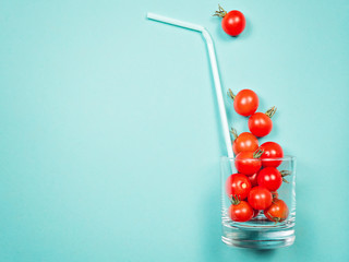 Tomato juice or smoothie, cherry tomato in drink glass with straw