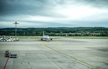 Plane waiting for departure next to the runway