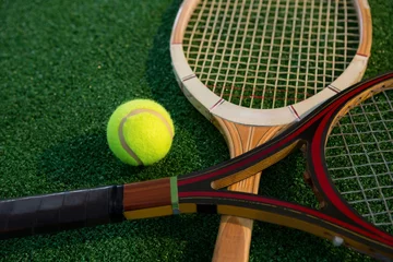 Wandaufkleber Close up of wooden racket with tennis ball © WavebreakMediaMicro