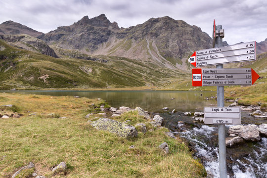 Hiking signs at Lagh di Tres, val grosina, valtellina, province of sondrio, lombardy, italy
