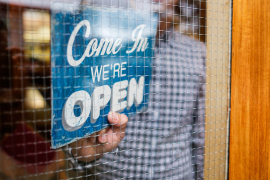 Small business owner opening his store