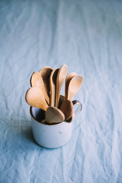 Wooden spoons on a blue backgrownd