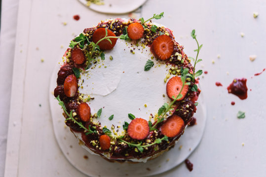Delicious cake; naked cake with strawberries decorated with mint leaves