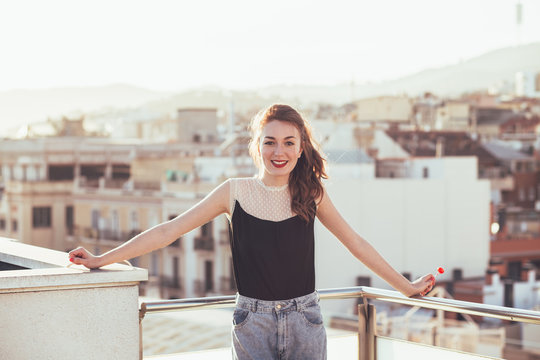Smiling woman on a terrace