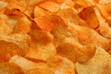 Golden Chips potato texture. Food Background of delicious chips