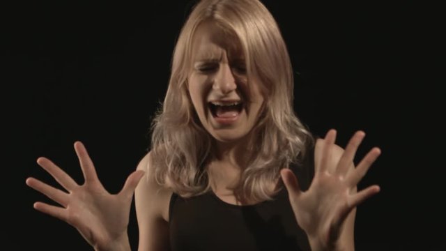 Angry woman screaming with rage, furious and dangerous