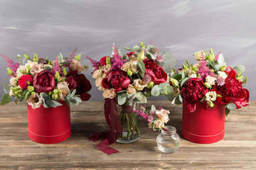 Bridal bouquet and boutonniere. Red and peach color flowers