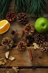 Christmas wood background with fruits and spices 