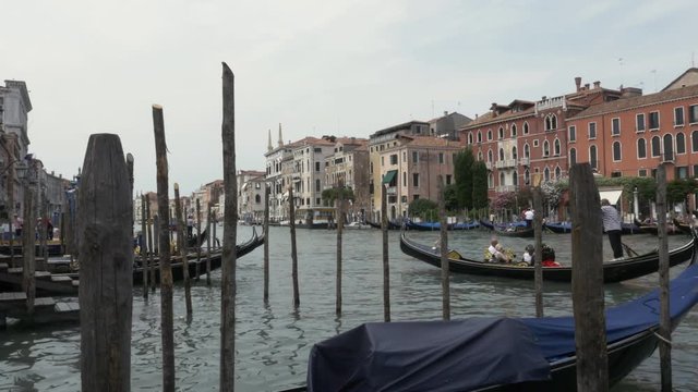 Gandola goes by near a Venice dock in Italy
