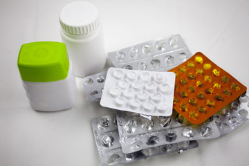 Pills background. Heap of assorted various medicine tablets and pills in blisters different colors...