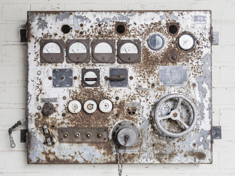 Old rusty regulator on a wall