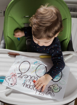Child Colouring Easter Eggs