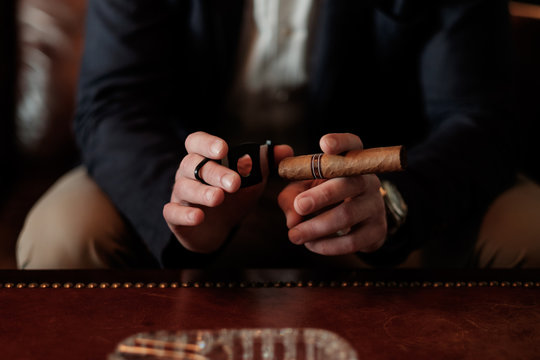 Close up of a Man Preparing to Light Up Cuban Cigar