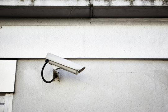 Security camera mounted on a wall