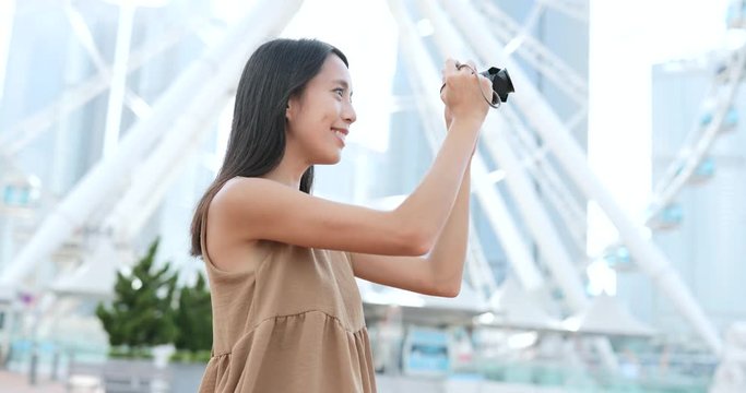 Woman traveler taking photo in Hong Kong