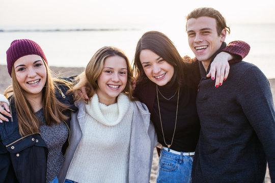 Portrait of teenage friends on a beach.