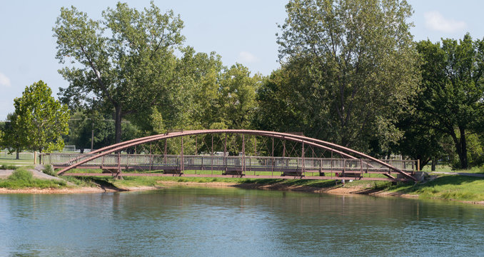 A scenic view of a bridge over a waterway in a Missouri park.