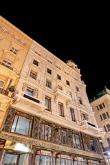 Low angle view of historic illuminated building at night between Graben, Stephansplatz and...