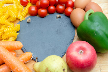 Food groups, natural healthy fruit and vegetables with a heart shape