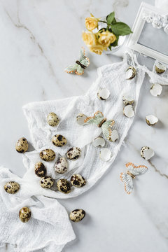 Quail eggs, butterflies and flower