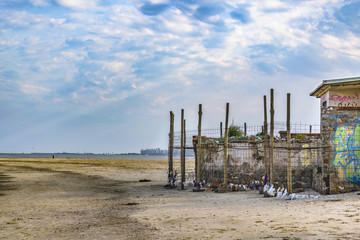 Abandoned Waterfront Building at Beach