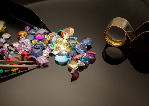 Jewel or gems on black shine color, Collection of many different natural gemstones amethyst, lapis lazuli, rose quartz, citrine, ruby, amazonite, moonstone, labradorite, chalcedony, blue topaz