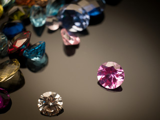 Jewel or gems on black shine color, Collection of many different natural gemstones amethyst, lapis lazuli, rose quartz, citrine, ruby, amazonite, moonstone, labradorite, chalcedony, blue topaz