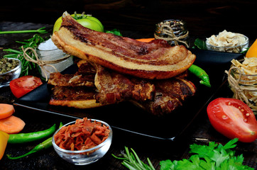 pork meat with vegetables on table