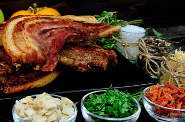 pork meat with vegetables on table