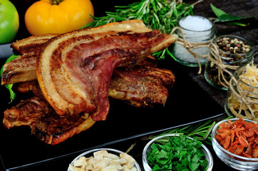 pork meat with vegetables on table
