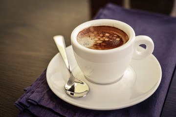 Espresso coffee in small white cup